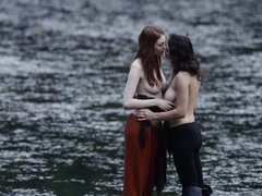 Young Raven Rockette and Bree Daniels engaged in lesbian sex on a raft in a lake