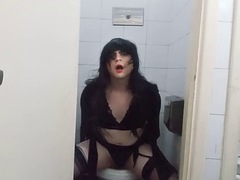 Trans Felixa in sexy black lingerie fucking with a dildo in a public bathroom