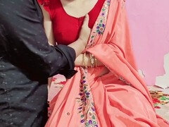 Hot Indian bhabhi in red saree gets seduced in a corner