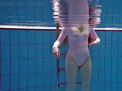 Simonna is hot and horny in the public pool