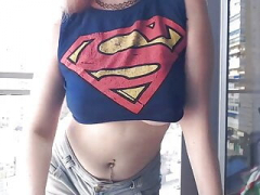 Supergirl Clothed flashing jugs in balcony