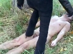 Submissive sex slave treated like a dog outdoors