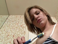 Tall and skinny teen masturbates with her electric toothbrush