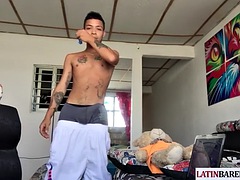 Tattooed Latino twink tugging on his shaved cock