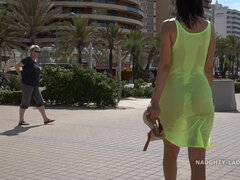 Naughty mom by the sea in see thru Yellow dress flashing shaved cunt