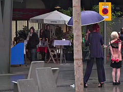 Lezdom redhead MILF shows teen slave outdoor in public