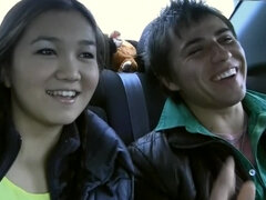 Alluring Asian chick fools aournd with her boyfriend in the car