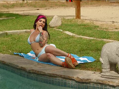 Joanna Angel masturbating her shaved pussy poolside