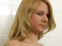 Blonde slut lathers her clean-shaven cum bucket