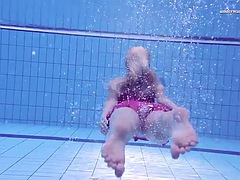 Hot Russian babe Elena Proklova swims naked