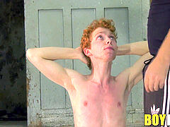 Mature dom gives a hand job to bound redhead youngster Avery Monroe