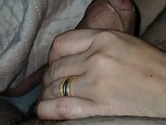 Stepmother under the blanket jerks off stepsons dick