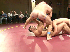 naked boys grappling on the floor