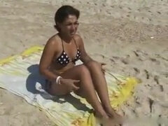 Woman pickup on the beach
