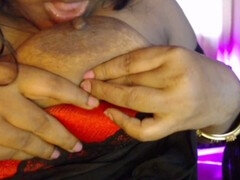 Naughty Desi girl pleasures herself by teasing her nipples while watching live men