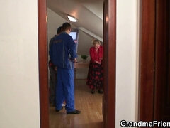 Watch two repairmen bang their very old granny with a busty blonde bombshell in HD