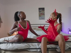 Two ebony chicks are cosplaying like slutty devils