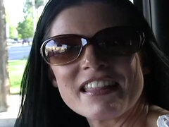 Hot raven-haired milf in sunglasses gives head in the car