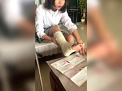 asian dame crutches with sprain ankle in fat bandage