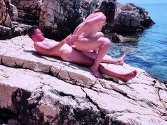 Real amateur couple Evelyn Noire and JacqOfAll get it on at a rocky beach while a drone captures the action