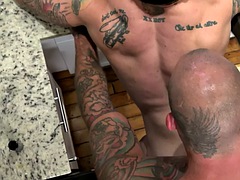 Ink MTF gay pussy fucked by tattooed jock in kitchen after blowjob