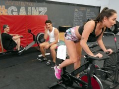 Karlee Grey rides a bike in the gym and flashes her pussy