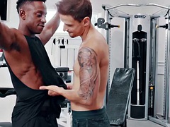 Handsome guy seduced and fucked by his muscular black trainer