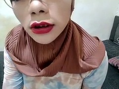 Indonesian shemale with hijab jerks off her cock