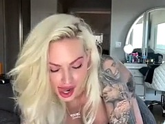 Blonde with big boobs masturbates with a dildo in the bathroom