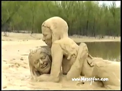 2 girls play in the mud