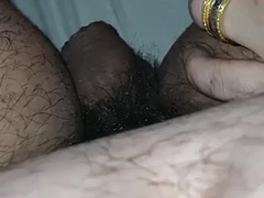 Stepmothers hand slides on her stepsons leg near his cock in bed
