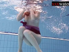 Smoking hot Russian redhead in the pool