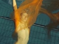 Yellow and furthermore Red clothed teen underwater