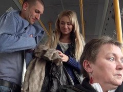 A blonde is getting fucked hard in the bus while people are looking