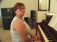 Plump piano teacher busted getting skewered with a couple of dicks