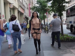 Kinky lady with sizeable bra buddies is walking naked around town