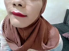 Indonesian shemale with hijab jerks off her cock