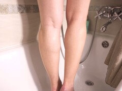 Seductive amateur showers and teases with her irresistible calves