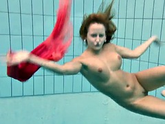 Busty Silvie swims and shows her hairy pussy