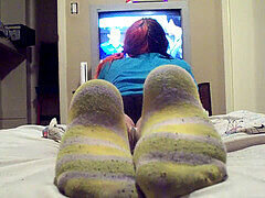 Goth girl dominates with smelly socks in POV foot worship session