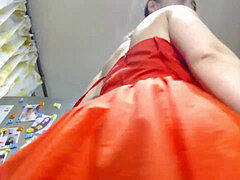 super-sexy Lovegalun in a red dress plays with a fake penis in the kitchen.