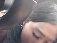 Asian girl sucks a BBC in the car