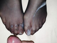 Black nylon sock on Wife's french toenails in element covered by big cum load