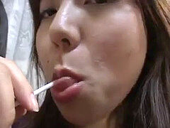 trio cute chinese femmes licking lollypops