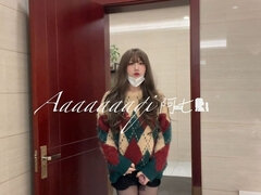 Transvestite Ah Qi "cute Shemale in Wide Sweater and Duck Shoes in Public Toilet"