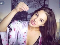 Cute-looking redhead hottie Evelin Stone is sucking a big rubber toy