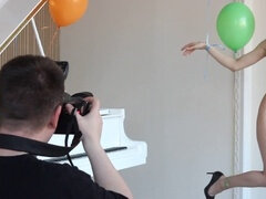 Behind the scenes with a sexy chick playing with balloons