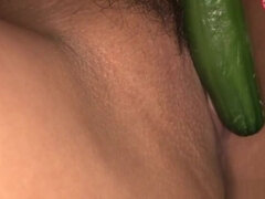 Asian alluring blonde has a cucumber stuck in her pussy