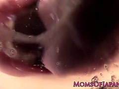 Watch this Asian MILF suck and swallow a load of jizz