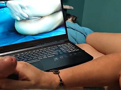 Watching porn while giving a handjob